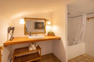 a bathroom with a sink and a shower at Masia Brugarolas in Castelltersol +19 photos