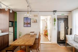 a kitchen and dining room with a wooden table at Pachira House in Seoul