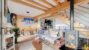 a living room with a couch and a table at Buron St Roch in Murol