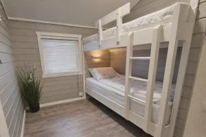 Giường trong phòng chung tại Etne Hytter