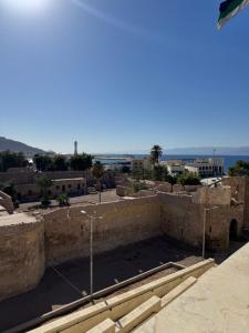 a view of a city from the top of a building at Happy Beach Castel for Apartment قلعة شاطئ السعادة للشقق المفروشة in Aqaba