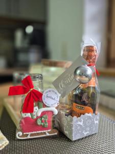 a gift box with a christmas ornament and a spoon at OTILIA apartment in Zell am See