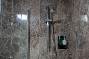 a shower in a bathroom with a glass door at The Salty Seagull in Scarborough +26 photos