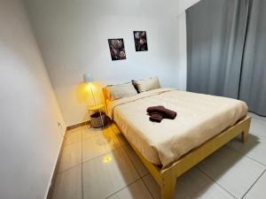 En eller flere senge i et værelse på Comfort Suites Austin Johor bahru