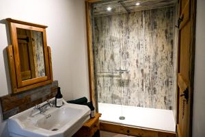 a bathroom with a tub and a sink and a shower at Pooh Corner in Hythe +31 photos