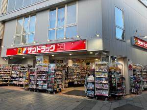 a store front of a store with a lot of products at Hachioji House 206 Apartment in Hachioji
