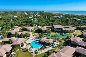 an aerial view of the resort with a pool and the beach at Blind Pass #E209 in Sanibel