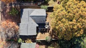 an aerial view of a house with trees at Stylish 4BR Home - Modern & Bright Interior in Charlotte +47 photos