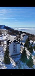 an aerial view of a building in the snow at GENCIAN RESORT in Kopaonik
