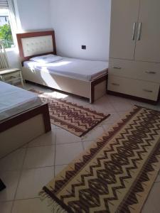 En eller flere senge i et værelse på Blin's Apartament