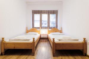 En eller flere senge i et værelse på Boho Apartment