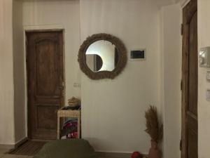 a room with a door and a mirror on the wall at Fresco in Dahab
