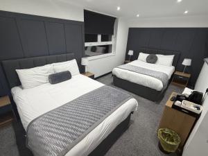 En eller flere senge i et værelse på Woodhouse Hotel Blackpool Promenade + 27 billeder