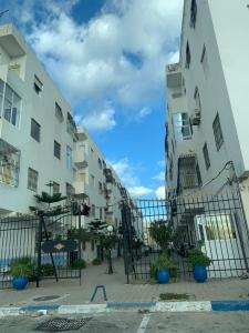 a fence in front of a building at bel appartement à Martil in Martil