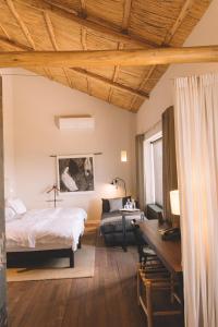 Postel nebo postele na pokoji v ubytování Titilaka by Andean