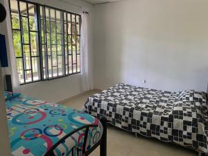 Postel nebo postele na pokoji v ubytování El Paraíso