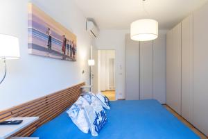 En eller flere senge i et værelse på Domus Portofino - Relax & Live the Italian Riviera