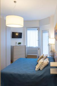 En eller flere senge i et værelse på Domus Portofino - Relax & Live the Italian Riviera + 25 billeder