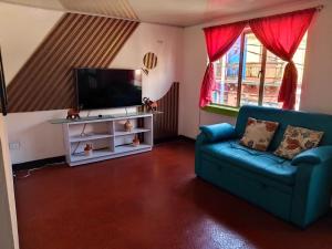 Et tv og/eller underholdning på Apartaestudio zona central Pasto