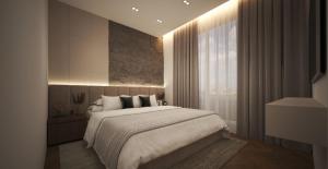 een slaapkamer met een groot bed en een raam bij Montéa Villa in Brezovicë