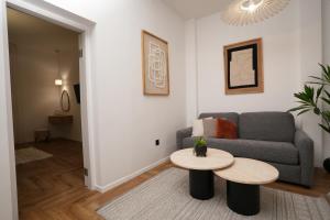 a living room with a couch and a table at One Apartments TLV in Tel Aviv