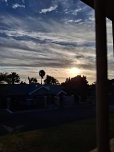 a view of the sunset from a house at Spacious Suite in Somerset West in Somerset West