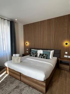 Giường trong phòng chung tại Tritoni Casa Kappuccini