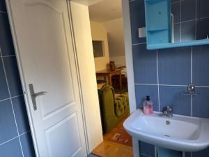 a bathroom with a white sink and a mirror at Apartments and Rooms Vicko in Brzeće +103 photos