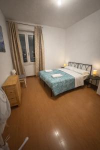 a hotel room with a bed and a window at Easy Room Italy Central Station in Milan
