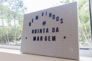 a book sitting on top of a window sill at Pousada Quinta da Margem in Florianópolis +245 photos