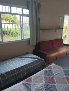 En eller flere senge i et værelse på Casa Praia Beto Carrero World