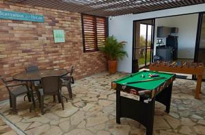 a patio with a pool table and a ping pong ball at LUZ DE LUNA mesa de los santos house in Los Santos