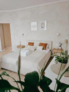 En eller flere senge i et værelse på Apartamenty Paryskie Old Town View