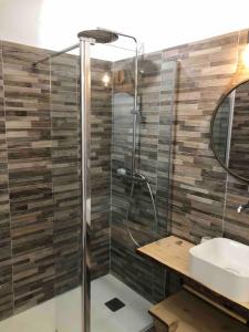 a bathroom with a shower and a sink at LES BATTERIES bord de mer in Collioure +20 photos