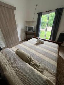 En eller flere senge i et værelse på Depto 168