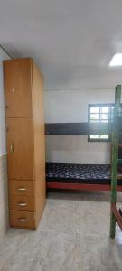 En eller flere senge i et værelse på Hostel33 brazil praia