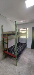 En eller flere senge i et værelse på Hostel33 brazil praia