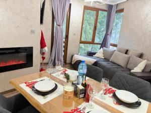 a living room with a santa hat on a table at Dream Apart - Iceberg in Pamporovo