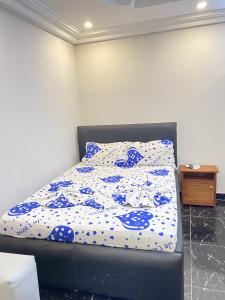 En eller flere senge i et værelse på Apartement Chaleureux et Prestigieux