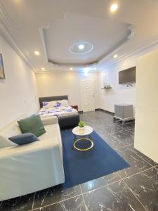 En eller flere senge i et værelse på Apartement Chaleureux et Prestigieux