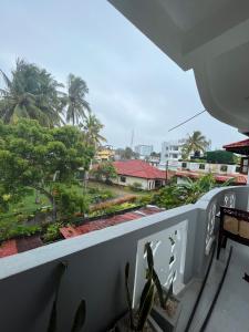 a balcony with a view of a city at Galle City Guest in Galle +6 photos
