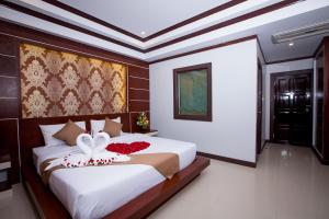 Ліжко або ліжка в номері Phi Phi Andaman Beach Resort