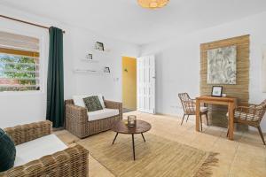 a living room with a couch and a table at Maravia Bonaire in Kralendijk