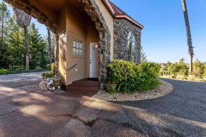 a stone house with a white door on a street at Bella Villa Messina in Healdsburg