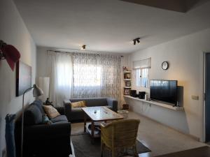 TV a/nebo společenská místnost v ubytování Acogedoras Habitaciones Privadas zona Costera Wifi