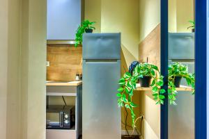 Kuchyň nebo kuchyňský kout v ubytování Piata Romana Suites & apartments - Pumo Properties