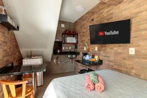 Et tv og/eller underholdning på Estúdio com ar condicionado próximo ao centro e UDESC CEFID