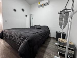 En eller flere senge i et værelse på Departamento LUNA