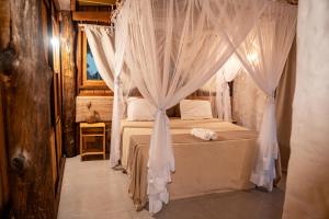 Cama ou camas em um quarto em Vila do Junco