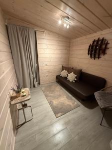 Et opholdsområde på Obuoliu Sala COZY HOUSE on the Apple Island